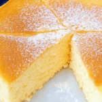Heavenly Cloud Cake Recipe You’ll Make Again And Again 2 Fluffy cloud cake sliced and dusted with powdered sugar