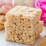 Rice Krispie Treat Recipe That’s Perfectly Soft, Gooey, and Irresistible 2 stacked rice krispie treats dessert bars