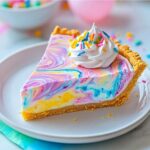 Easter Swirl Pie Recipe 2 Easter swirl pie slice with yellow, pink, and blue cream filling