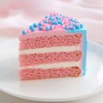 Gender Reveal Cake Recipe: A Delightful Surprise for Every Celebration 2 Single slice of gender reveal cake with pink and blue frosting