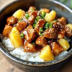 Pineapple Chicken and Rice: The Ultimate Sweet and Savory Combo 2 Pineapple chicken and rice with golden pineapple and sesame seed topping